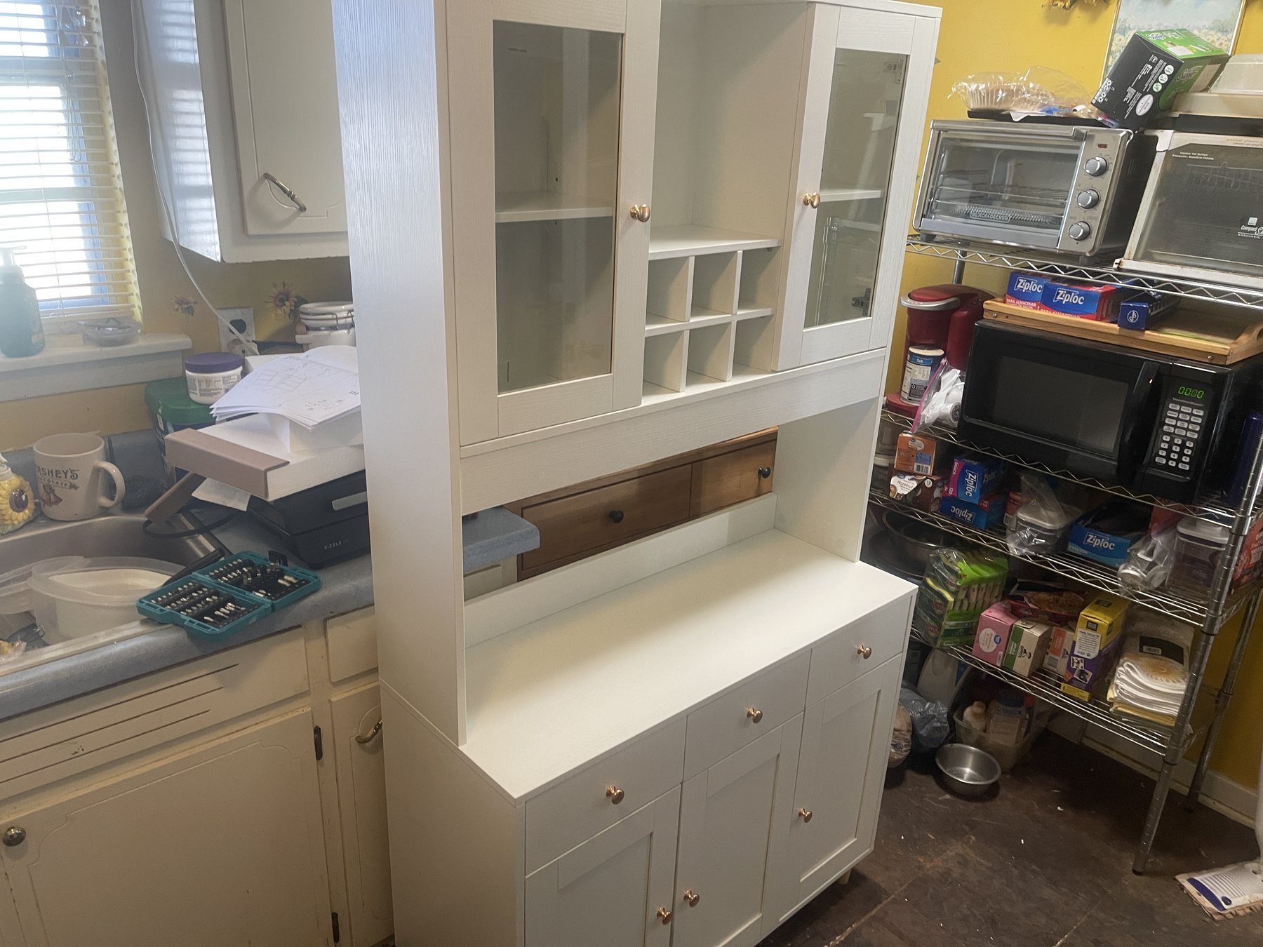 White custom storage cabinet assembled and fitted by Only Solutions